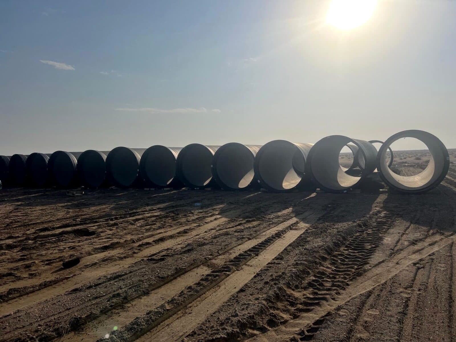 Large ductile-iron pipe sections staged on site