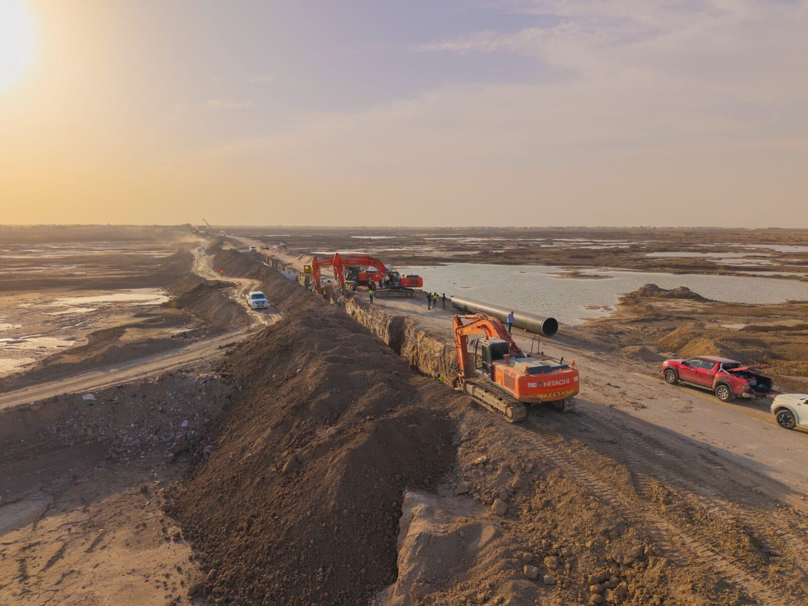 Aerial view of pipeline construction at sunset in Iraq